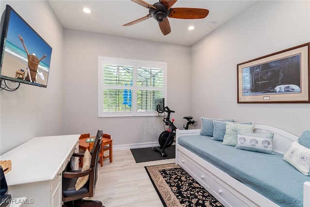 office area with light hardwood / wood-style floors and ceiling fan