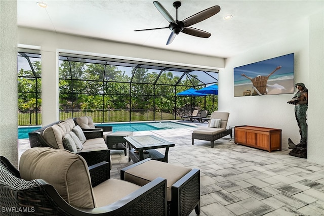 view of patio featuring an outdoor living space, a lanai, ceiling fan, and a fenced in pool