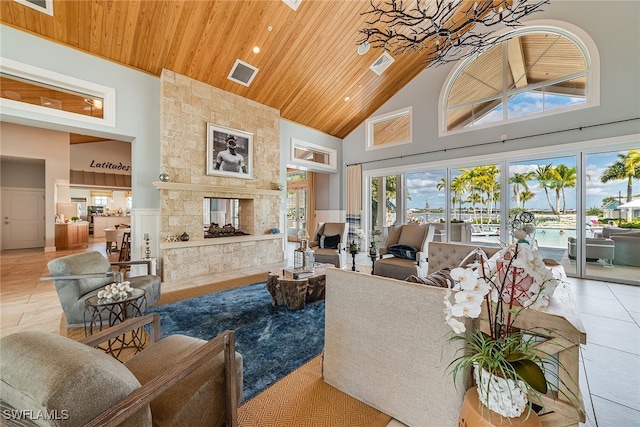 living room featuring a fireplace, light tile patterned floors, high vaulted ceiling, and wooden ceiling