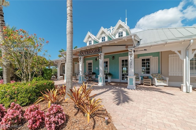 back of house featuring a porch