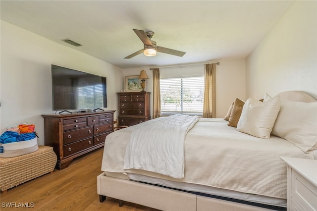 bedroom featuring light wood-type flooring and ceiling fan