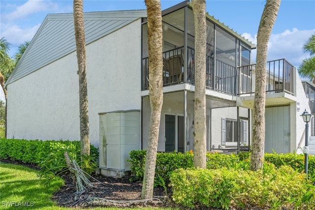 view of property exterior with a balcony