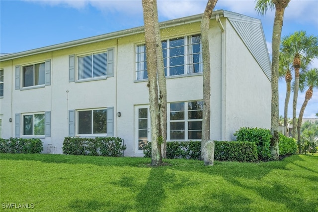 view of property exterior featuring a yard