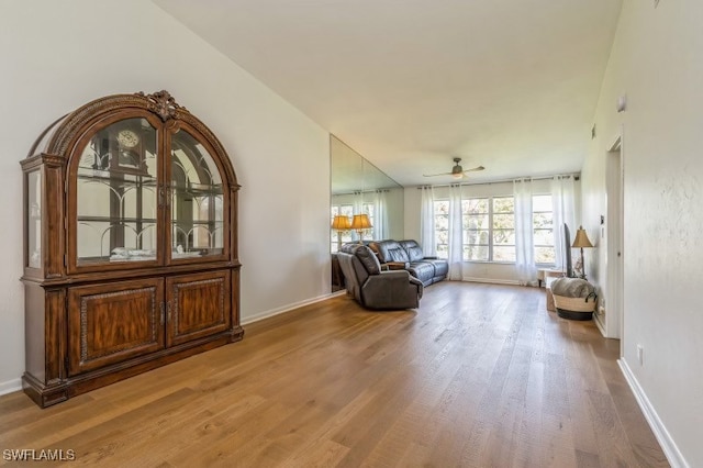 sitting room featuring hardwood / wood-style floors and ceiling fan