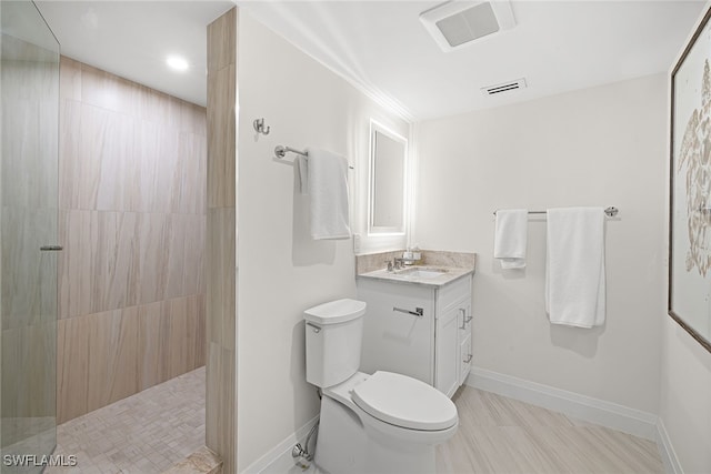 bathroom featuring walk in shower, vanity, and toilet