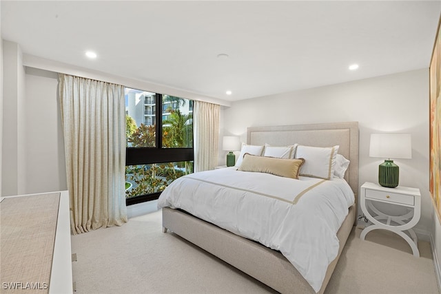 bedroom with light colored carpet