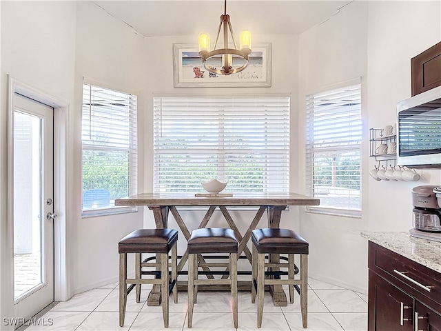 dining area with a chandelier