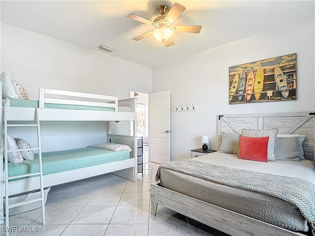 tiled bedroom with ceiling fan