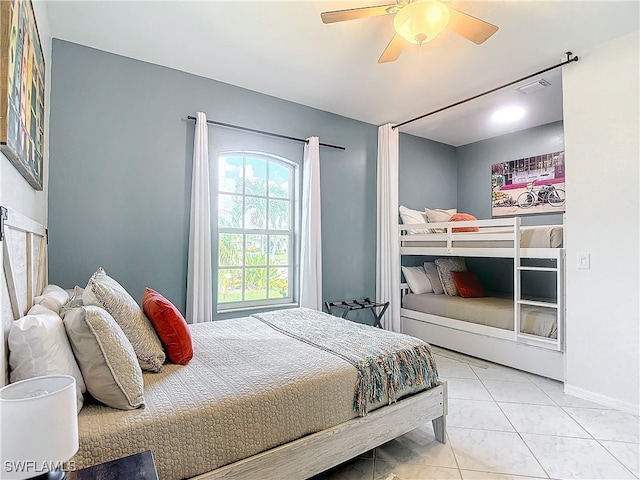 tiled bedroom with ceiling fan