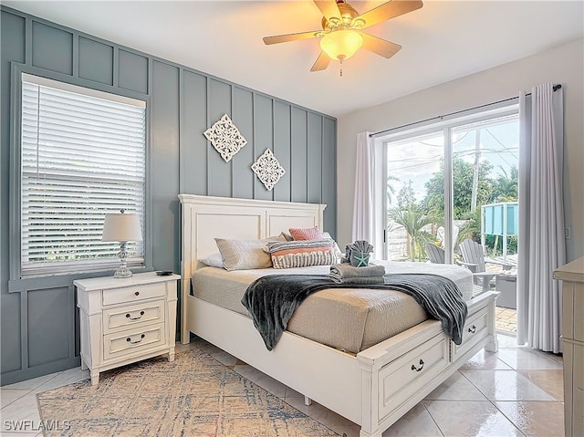 bedroom with ceiling fan and light tile patterned floors