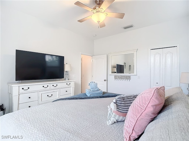 bedroom featuring a closet, ceiling fan, and carpet flooring