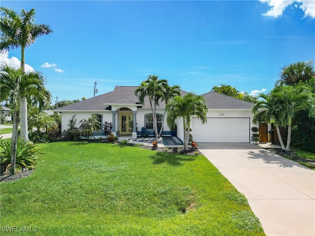 view of front of home with a garage and a front yard