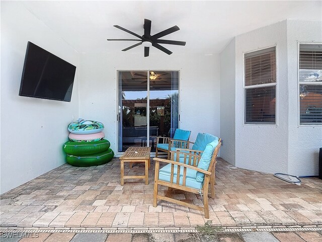 view of patio / terrace with ceiling fan and an outdoor hangout area