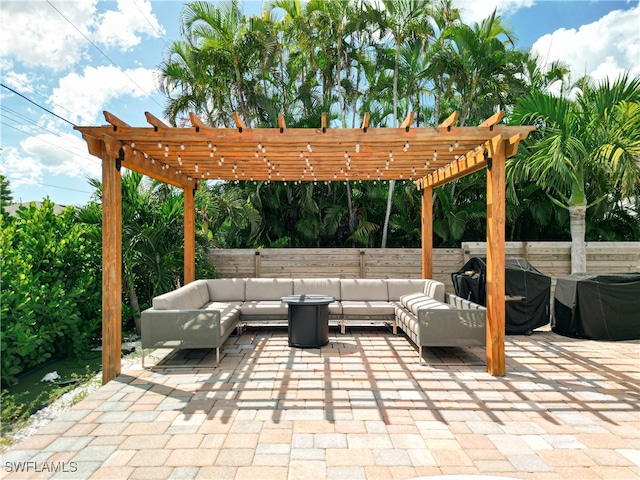 view of patio featuring a pergola, an outdoor living space, and area for grilling