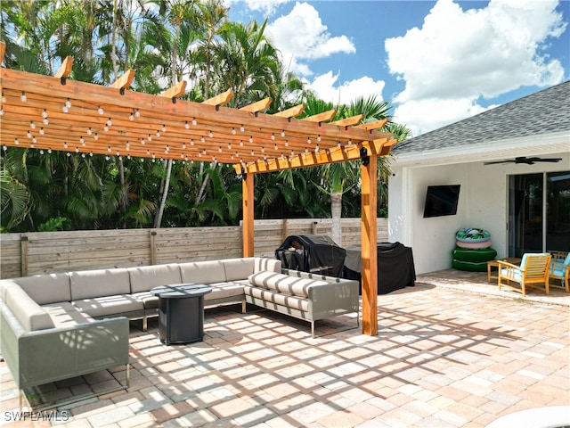 view of patio / terrace featuring a pergola, area for grilling, ceiling fan, and an outdoor hangout area