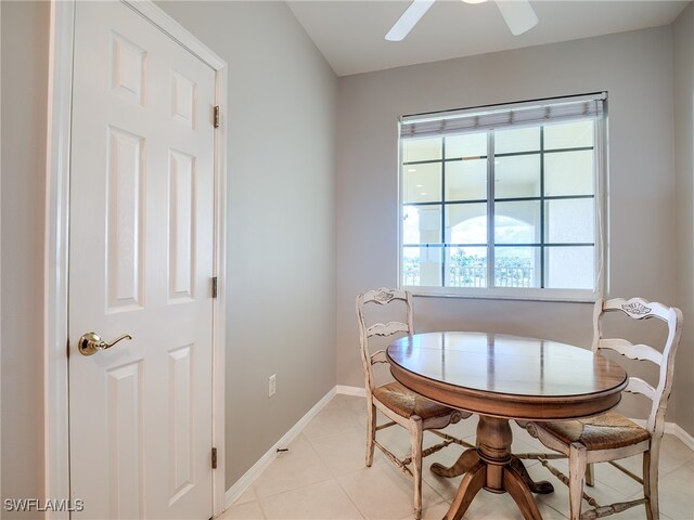 dining room with light tile patterned floors and ceiling fan