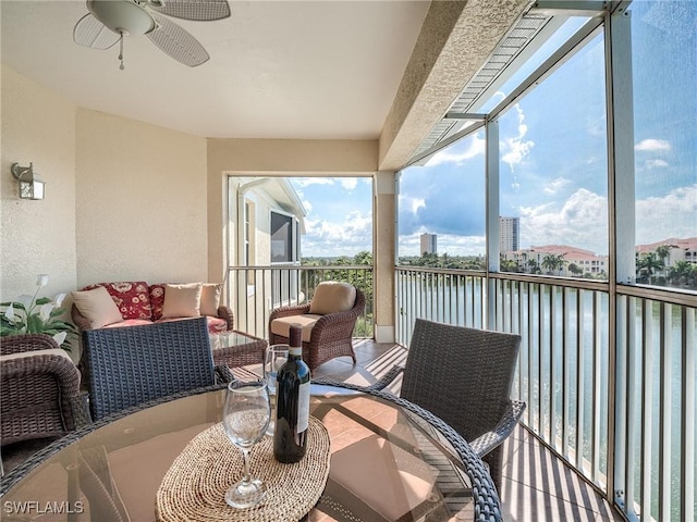 20011 Sanibel View Cir # 302, Fort Myers, FL 33908 - sunroom with a ceiling fan and a water view