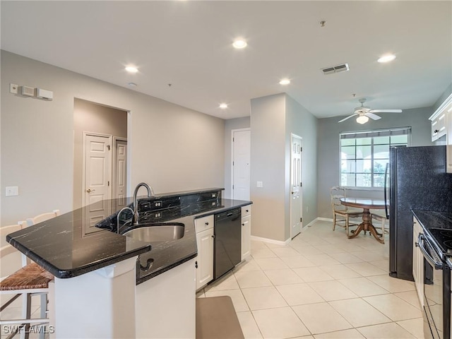 20011 Sanibel View Cir # 302, Fort Myers, FL 33908 - kitchen featuring black appliances, white cabinets, ceiling fan, a center island with sink, and recessed lighting