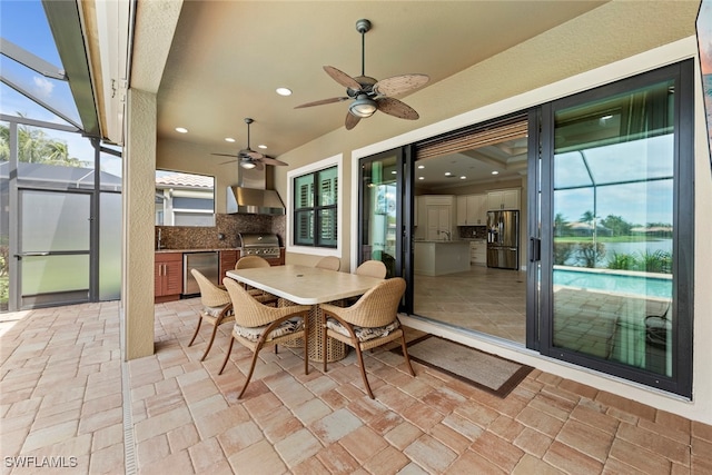 sunroom / solarium with ceiling fan