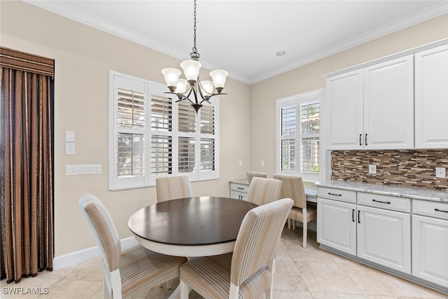 dining room featuring an inviting chandelier, ornamental molding, and light tile patterned flooring