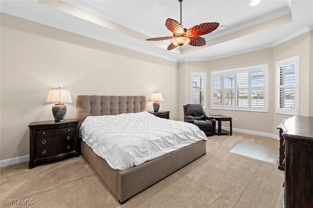 carpeted bedroom with crown molding, a raised ceiling, and ceiling fan