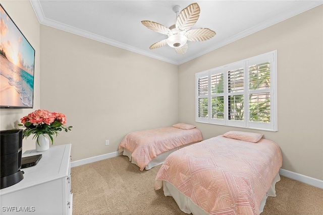 carpeted bedroom featuring crown molding and ceiling fan