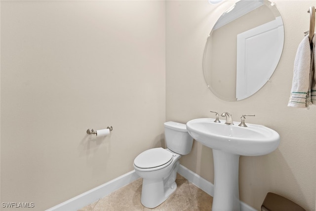 bathroom featuring toilet and tile patterned floors