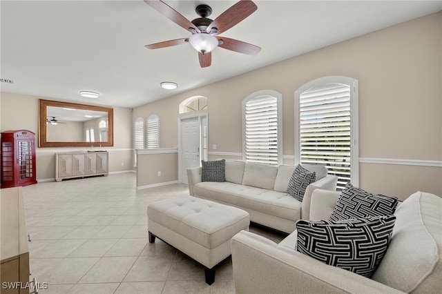 living room with light tile patterned flooring and ceiling fan