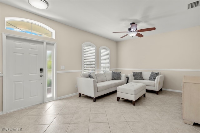 entryway with light tile patterned flooring and ceiling fan