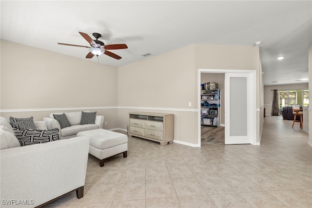 living room with light tile patterned floors and ceiling fan