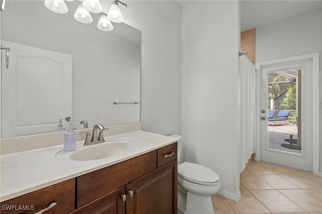 bathroom featuring vanity, walk in shower, toilet, and tile patterned flooring