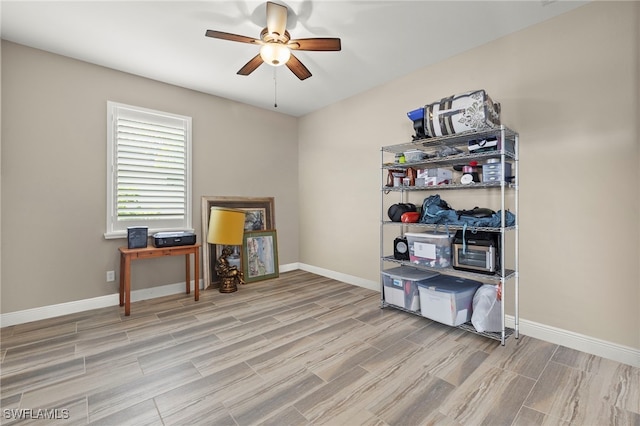 miscellaneous room featuring ceiling fan and light hardwood / wood-style flooring