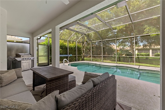 view of swimming pool with a patio area, a lanai, an outdoor hangout area, and a grill