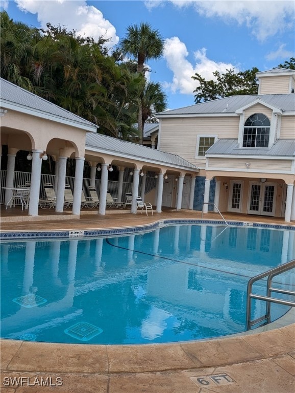 view of swimming pool featuring a patio