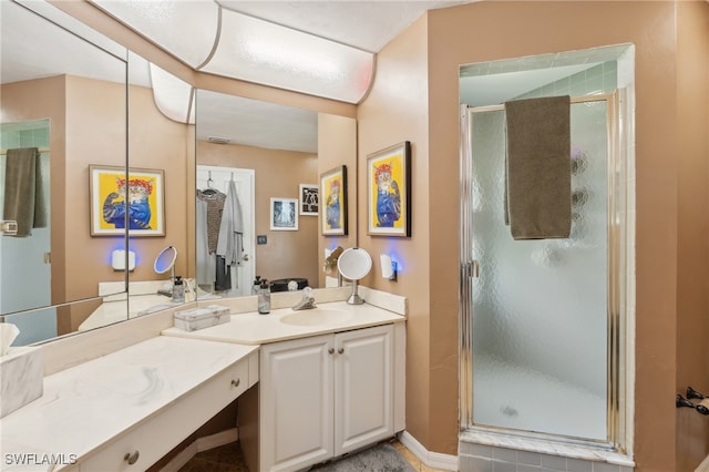 bathroom featuring vanity and walk in shower