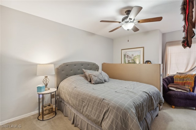 bedroom with light colored carpet and ceiling fan