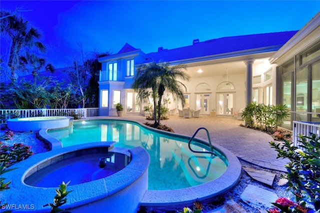 view of pool with an in ground hot tub and a patio area