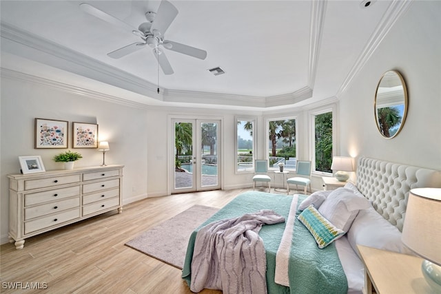 bedroom featuring french doors, access to exterior, light hardwood / wood-style flooring, ornamental molding, and ceiling fan