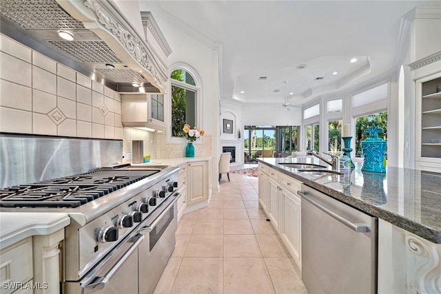 kitchen with backsplash, appliances with stainless steel finishes, sink, and plenty of natural light