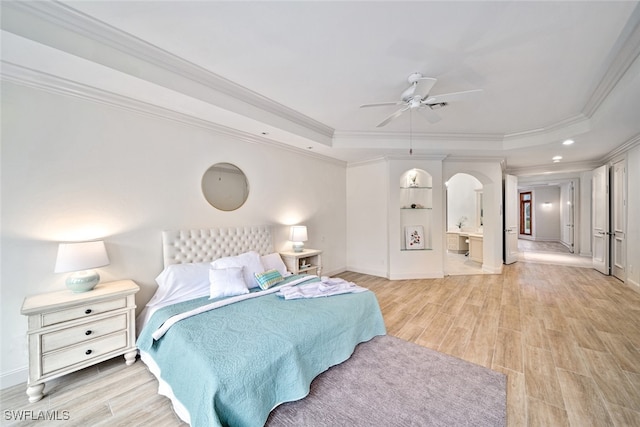 bedroom with ceiling fan, crown molding, and a raised ceiling