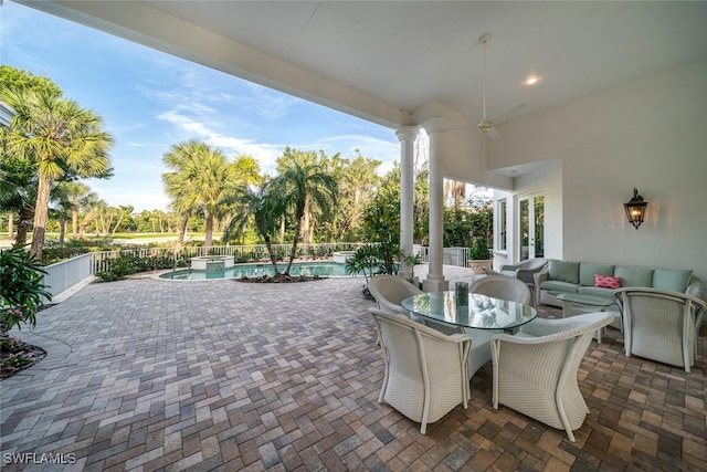 view of patio / terrace with an outdoor hangout area, a fenced in pool, and ceiling fan