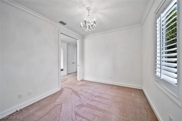 carpeted empty room featuring a notable chandelier and crown molding