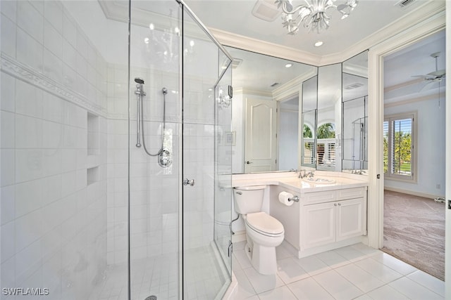 bathroom featuring toilet, ornamental molding, a shower with shower door, vanity, and tile patterned floors