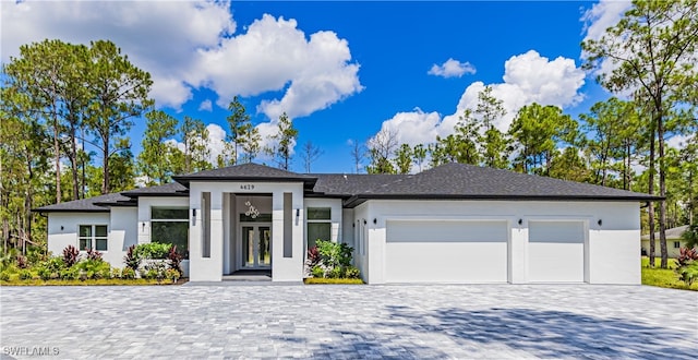 prairie-style home featuring a garage