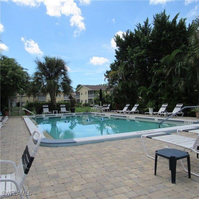 view of swimming pool with a patio