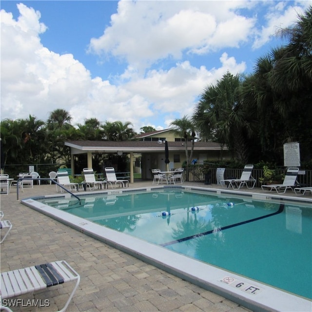 view of swimming pool featuring a patio area