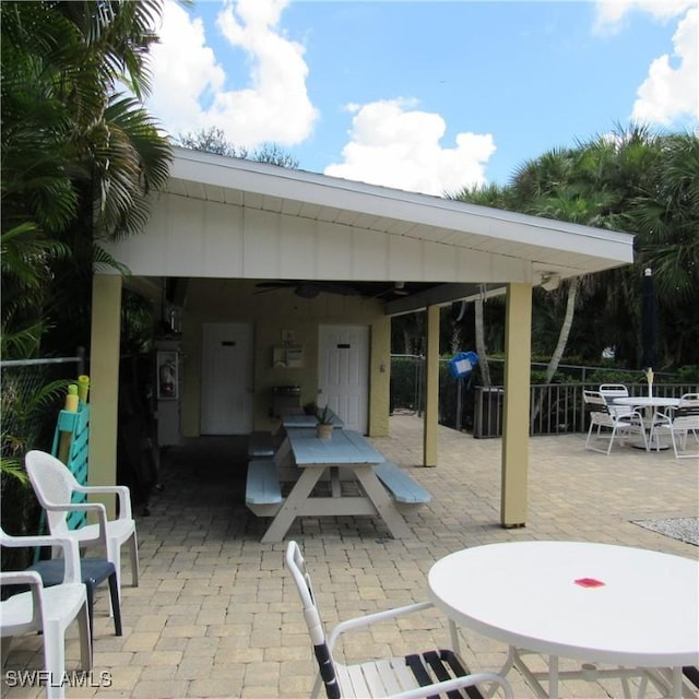 view of patio / terrace with outdoor dining space and fence