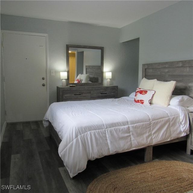 bedroom featuring dark wood-type flooring