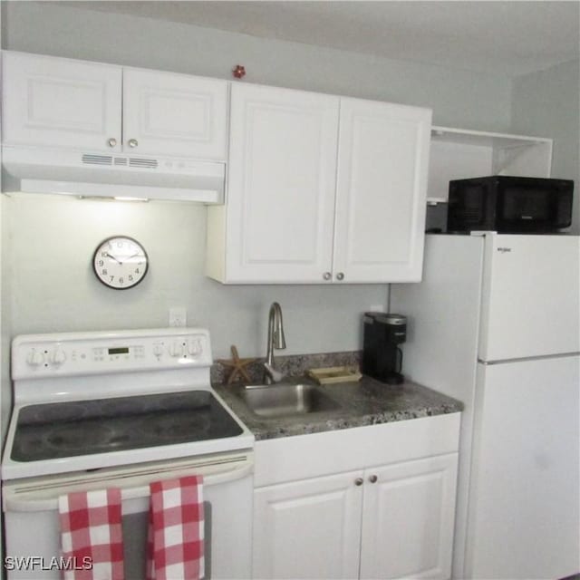 kitchen featuring white appliances, white cabinetry, a sink, and under cabinet range hood