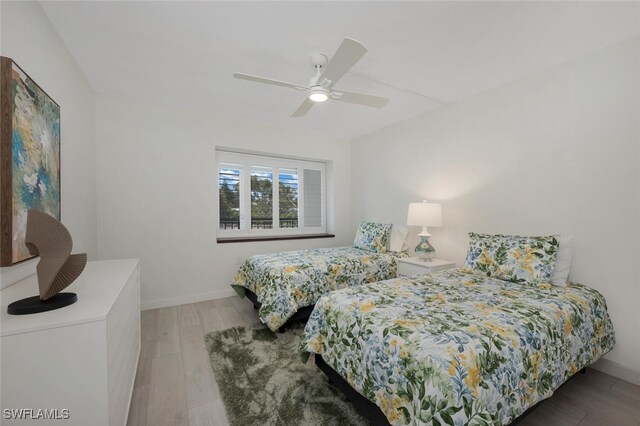 bedroom featuring ceiling fan and hardwood / wood-style floors